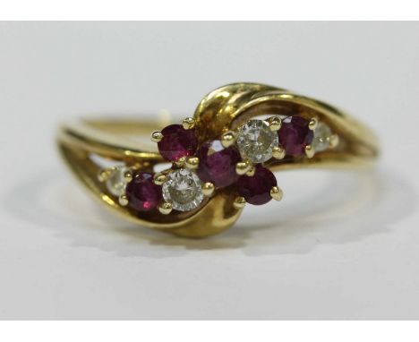 A 9ct gold, diamond and ruby floral cluster ring, 2.3 grams