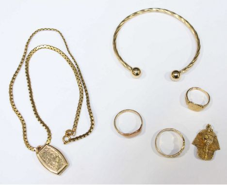 A collection of assorted 9ct gold jewellery, including three signet rings, a Pharos head pendant, a bangle and locket on chai