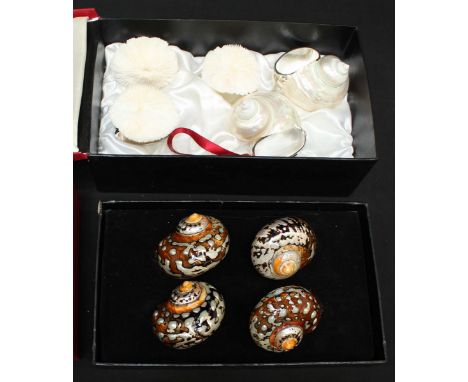 Two sets of Hans Turnwald silver plated mother of pearl conch shell mounted napkin rings, in presentation boxes