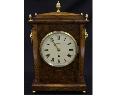 A figured and burr walnut Georgian design bracket clock by Barwise of London, the cream painted dial with black Roman numeral