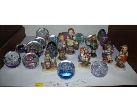 SECTION 3. A collection of seven Goebel pottery figures of children, together with a collection of paperweights