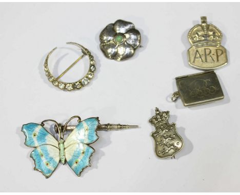 An Edwardian Liberty & Co Cymric silver and turquoise flower head brooch, hallmarked Birmingham 1904, together with an enamel