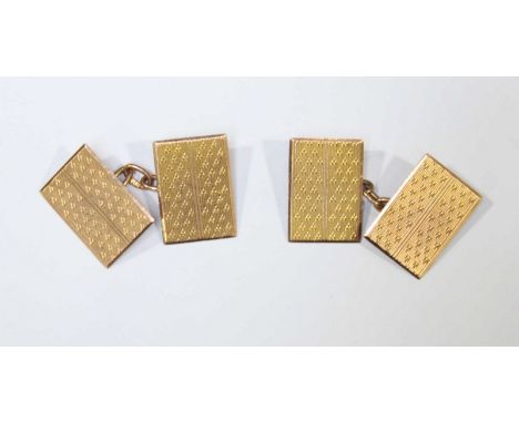 A pair of gent's 9ct gold cufflinks each rectangular button with engine-turned decoration, approximately 4.23grms
