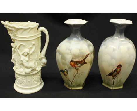 A Royal Worcester moulded cream-glazed Parian porcelain jug, with mythological sea beast handle, mask spout and with Venus an
