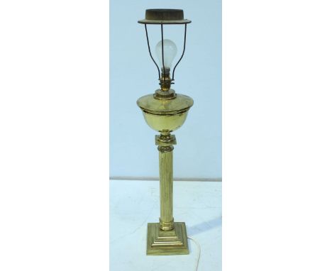 A brass column table lamp with fabric shade