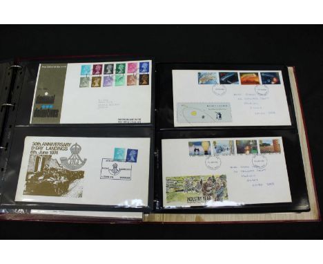 A collection of approximately 100 first day covers in two albums
