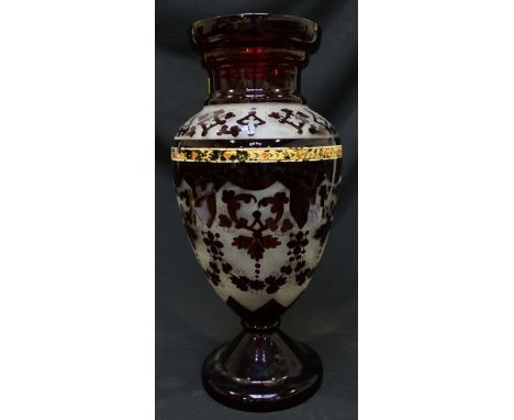 A large ruby glass baluster vase, decorated with frosted bands of scrolls and swags. 50 cm high