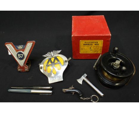 A small collection of assorted items including an AA car badge and another, boxed Allcocks Aerialist fishing reel, two founta