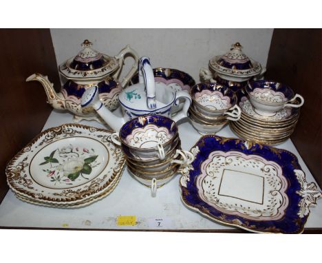SECTION 7. A Victorian porcelain part tea service, decorated with flowers on a blue and white ground
