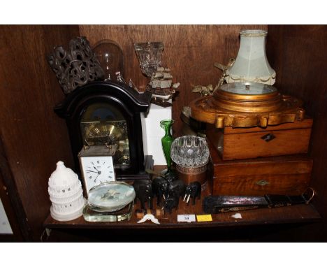 SECTION 34. A shelf of assorted items including a mantel clock, a gilded barometer, carved elephants, glass, two mahogany box