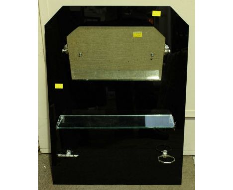 An Art Deco black glass bathroom mirror, with hinged mirrored panel, shelf and holders below