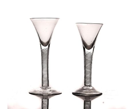 TWO AIRTWIST WINE GLASSESMid 18th centuryEach with drawn trumpet bowl raised on a multi series airtwist stem and plain foot, 