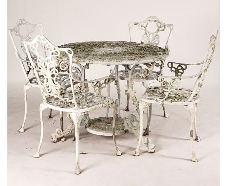 A WHITE PAINTED ALUMINIUM SHAPED CIRCULAR GARDEN TABLE (5)92cm diameter; 72cm high together with four matching arm chairs 52c