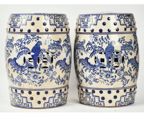 A PAIR OF CHINESE BLUE AND WHITE CERAMIC BARREL SHAPED GARDEN SEATS (2)Of recent manufactureDecorated with parrots, 44.5cm hi