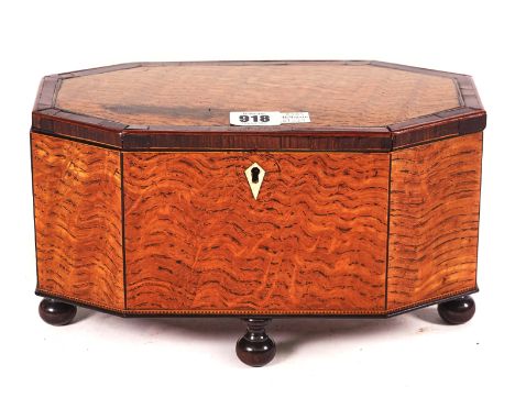 AN EARLY 19TH CENTURY LACEWOOD TEA CADDYOf compressed octagonal form, 28cm wide; 16cm highCondition report:&nbsp;The top with
