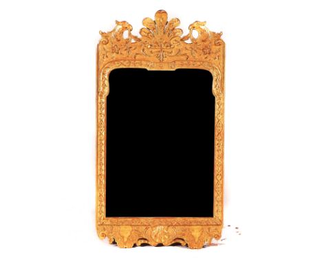 A GEORGE II GILT FRAMED MIRRORWith opposing eagle chrest, 49cm wide; 90cm highCondition report:&nbsp;The bevelled mirror plat