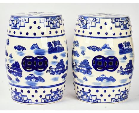 A PAIR OF CHINESE BLUE AND WHITE CERAMIC BARREL SHAPED GARDEN SEATSOf recent manufactureDecorated with chinoiserie landscape 