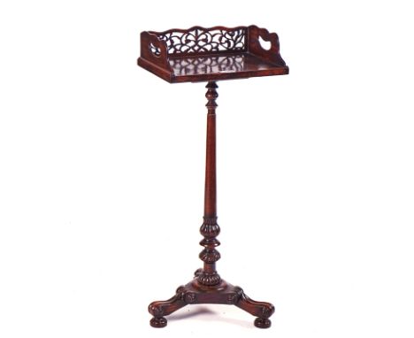 A 19TH CENTURY REGENCY STYLE ROSEWOOD BOOKSTANDWith fret carved gallery, on carved tripod base, 38cm wide; 90cm highcondition