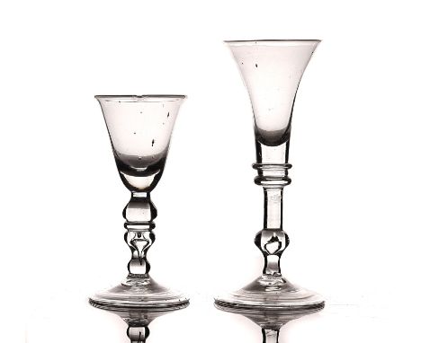 TWO BALUSTER WINE GLASSES18th century or possibly laterThe first with trumpet bowl, raised on a baluster stem and folded foot