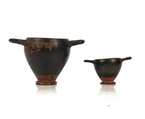 AN ATTIC STYLE BLACK GLAZED SKYPHOSProbably circa 5th century B.CWith net pattern decoration above the foot; and an Attic min