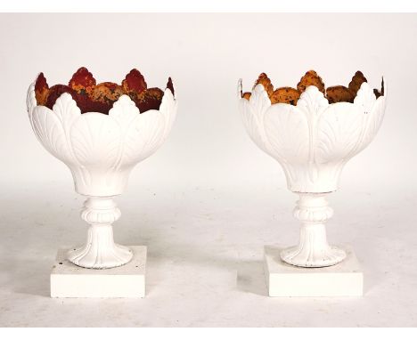 AN UNUSUAL PAIR OF 19TH CENTURY CAST-IRON GARDEN URNS (2)Each with leaf moulding, on turned sole and square bases, 53cm diame
