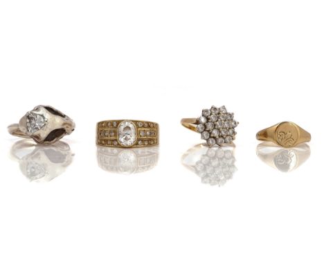 FOUR RINGSComprising; a gold and colourless gem set ring detailed K 14, ring size Q, gross weight 5.7 gms, a 9ct gold and col