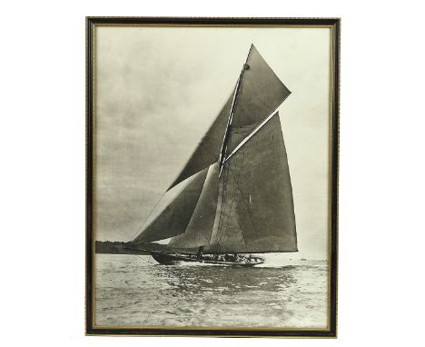 A BLACK AND WHITE PRINT OF HMY BRITANNIA (ROYAL CUTTER YACHT)Detailed to the lower right corner 'Beken &amp; Son Cowes, 1921'