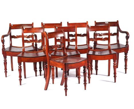 A SET OF EIGHT 19TH CENTURY FRUITWOOD DINING CHAIRS (8)With carved waist rail, on turned supports, to include a pair of carve