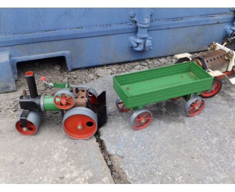 A Mamod steam powered car and a traction engine with trailor.  (3)