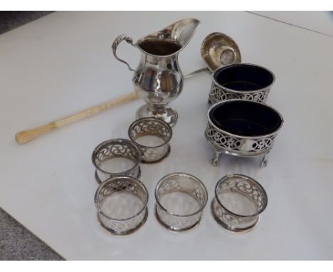 A pair of oval London silver salts – EJHNH, 1906, a silver punch ladle, five Birmingham napkin rings and a modern cream jug. 