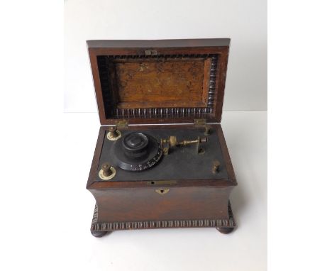 An Edison Bell Radio receiver housed in a rosewood caddy box, 8” across.