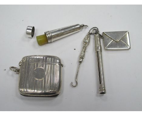 An Engine Turned Silver Vesta Case, cheroot holder in silver phiall, Sterling silver stamp holder as an envelope, pencil, but