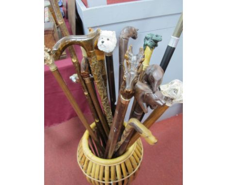 Sixteen Walking Sticks, all in a cane stick stand, with different handles, dogs, bear, horse, frog, ram etc.