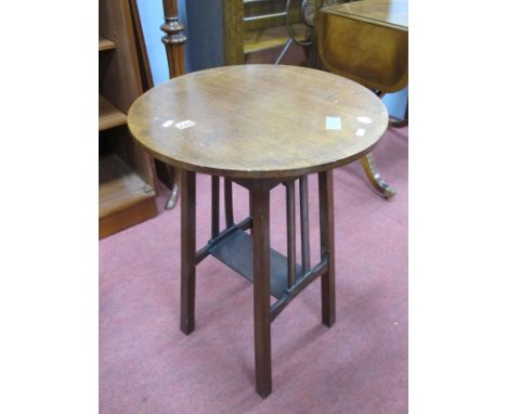 An Edwardian Inlaid Mahogany Occasional Table, with circular top, slatted supports, united by under shelf, 50 cm diameter