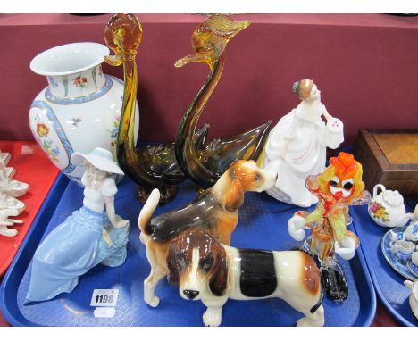 A Royal Doulton Figurine, 'Carol' Nao Figures, two pottery dogs, Royal Europe vase, two glass swans, crown:- One Tray