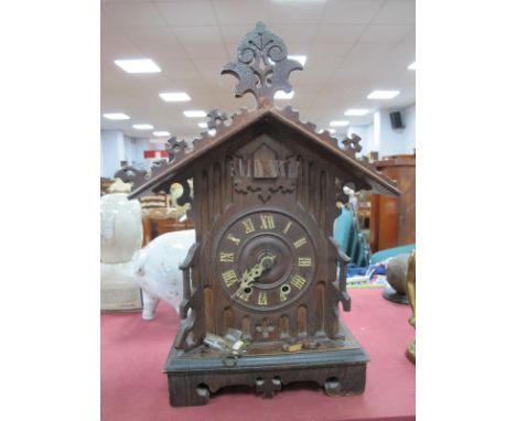 German Cuckoo Clock, with eight-day movement, in Gothic style arched case, 43cm high.