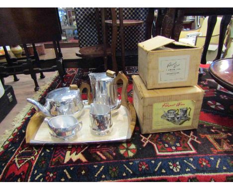 A five piece Picquot Ware tea set comprising of tray, boxed teapot etc