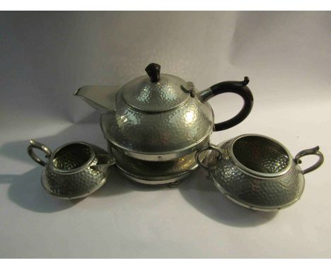 A pewter teapot with stand, jug and sugar bowl (4)