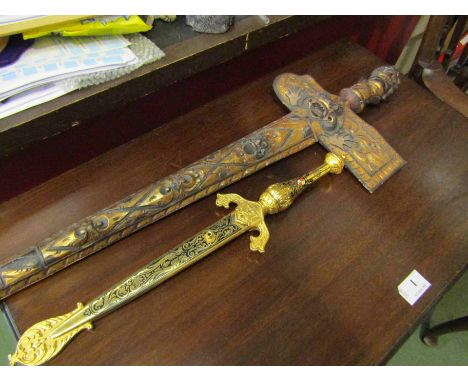 A decorative Malaysian Kris knife with carved gilt wood scabbard and a repro Spanish dagger