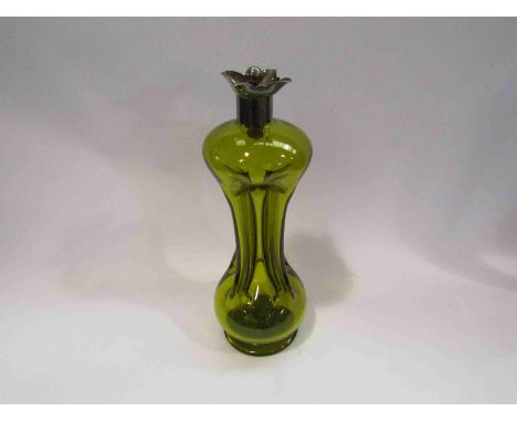 A Victorian Art Nouveau green glass decanter, 35cm tall