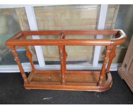 A 19th Century country house pitch pine large stick stand on turned supports, 123cm x 73cm x 29cm 