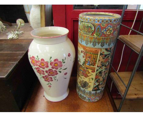 Two stick stands including cylindrical Oriental design example