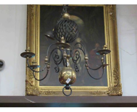A six branch ceiling light, brass and iron with swirled detailing 