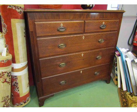 A George III north country mahogany inlaid oak chest of two short over three graduating long drawers on bracket feet, 118cm t