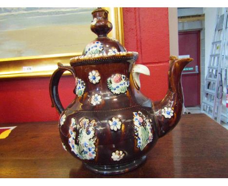 A Victorian Bargeware teapot with inscribed plaque, some damage    