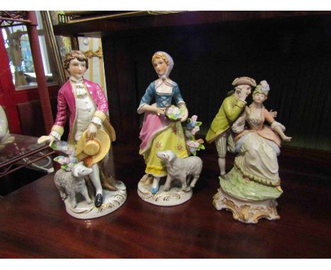 A pair of Continental ceramic figures with sheep and another (4)