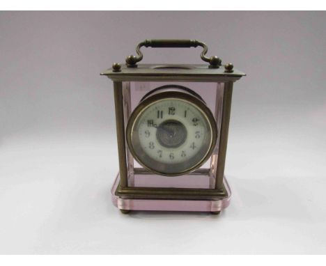 An early 20th Century carriage clock with pink tint glass
