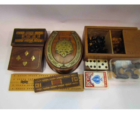 A box of miscellaneous games including chess set, cribbage boards, playing cards etc