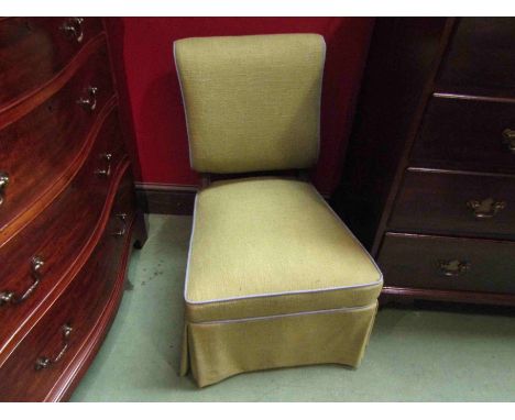An ebonised and walnut late Victorian open armchair on ceramic castors