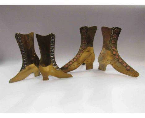 Two pairs of brass ornamental mantelpiece boots
